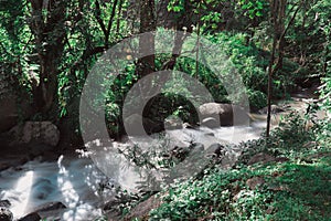 Soft water of the stream in the natural park, Beautiful waterfall in rain forest