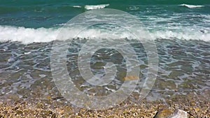 Soft wave of blue ocean on beach.