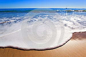 Soft wave of blue ocean on sandy beach