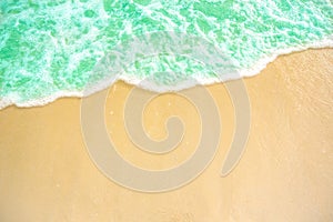 Soft wave of blue ocean on sandy beach. background. selective focus. beach and tropical sea white foam on beach.