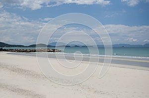 Soft wave of blue ocean on a sandy beach. With the blur. Toning