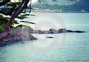 Soft wave of blue ocean on a sandy beach. With the blur. Toning