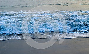 Soft Wave Of Blue Ocean On Sandy Beach. For using background. Selective focus. Sea Beach and Soft wave of blue ocean.