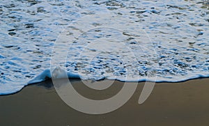 Soft Wave Of Blue Ocean On Sandy Beach. For using background. Selective focus. Sea Beach and Soft wave of blue ocean.