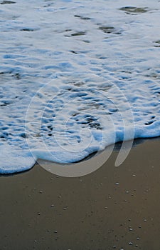 Soft Wave Of Blue Ocean On Sandy Beach. For using background. Selective focus. Sea Beach and Soft wave of blue ocean.