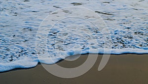 Soft Wave Of Blue Ocean On Sandy Beach. For using background. Selective focus. Sea Beach and Soft wave of blue ocean.