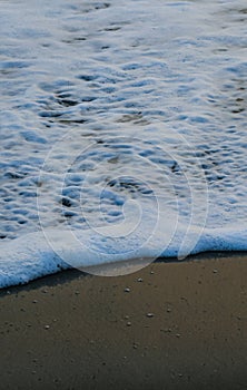 Soft Wave Of Blue Ocean On Sandy Beach. For using background. Selective focus. Sea Beach and Soft wave of blue ocean.