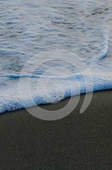 Soft Wave Of Blue Ocean On Sandy Beach. For using background. Selective focus. Sea Beach and Soft wave of blue ocean.