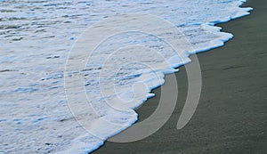 Soft Wave Of Blue Ocean On Sandy Beach. For using background. Selective focus. Sea Beach and Soft wave of blue ocean.