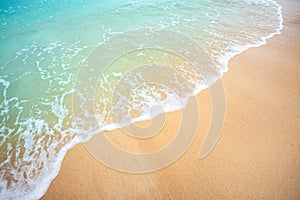 Soft wave of blue ocean selective focus on sandy beach ,On sandy beach background.