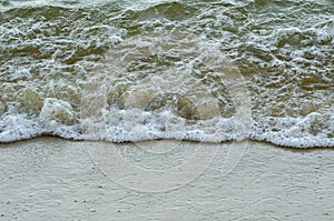 Soft wave hiting sandy beach at Nipah Bay Pangkor Island, Malaysia