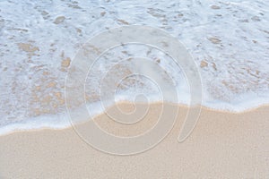 Soft wave of ocean on sandy beach. Summer vacation in island. clear azure water Background