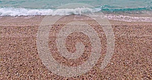 Soft wave on pebbles beach