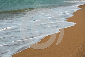 Soft wave of the sea on the sandy beach
