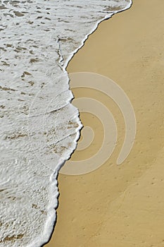 Soft wave of the sea on sandy beach