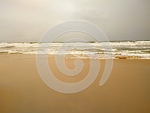 Soft wave sea on the sandy beach in summer