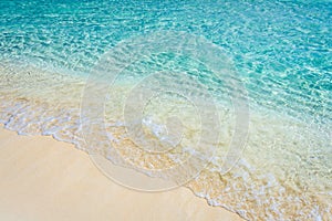 Soft wave of the tropical sea on the sandy beach