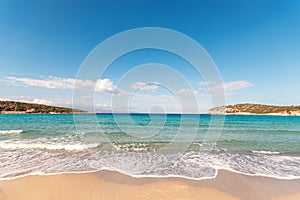 Soft waves of the sea on the beautiful beach on sky background. Voulisma beach in Creta island