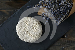 Soft white cheese on the black board