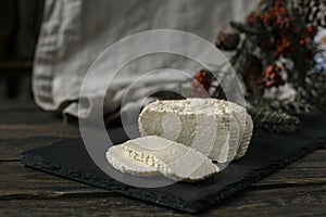 Soft white cheese on the black board
