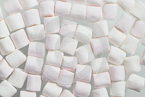 Soft white marshmallows, a type of confectionery which is typically made from sugar, water and gelatin whipped to a squishy