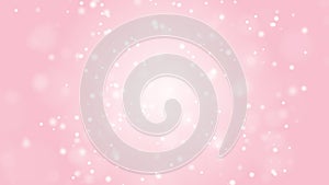 Soft white particles on a pink background.