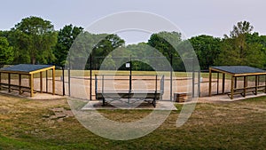 softball diamond in a city park in the early morning