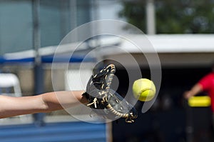 Softball Player Reaches Out To Catch Ball