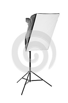 A softbox isolated on the white background. A professional stripbox. Photo studio equipment. Flashlight and outbreak.