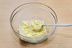 Softened butter in a glass dish, cooking home-made cake