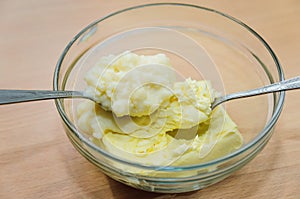Softened butter in a glass dish, cooking home-made cake