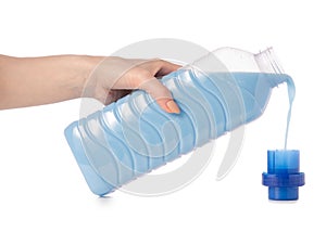 Softener conditioner in blue plastic bottle in hand isolated on white background