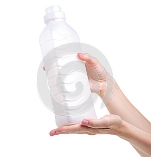 Softener conditioner in white plastic bottle in hand isolated on white background.