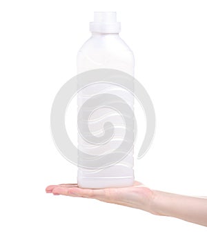 Softener conditioner in white plastic bottle in hand isolated on white background.