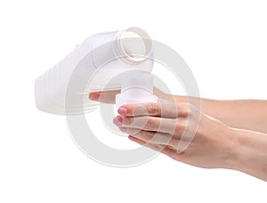 Softener conditioner in white plastic bottle in hand isolated on white background.