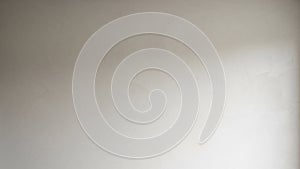 Softly Lit Textured Wall Surface with Subtle Gradient and Shadow background plaster