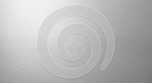 A softly textured light gray gradient background with subtle variations