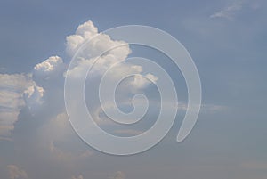 The softness of the white clouds and sky with the light shining from an interesting light pattern against the sky. Skies