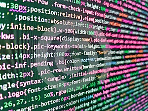 Software background technology. Website design. Blurred screen with selective focus. Developer software programming code. Binary