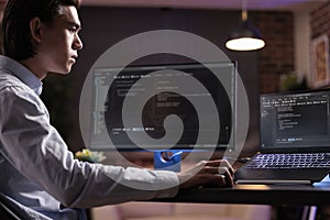 Software developer coding firewall program