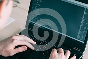 Software developer coding laptop programming it