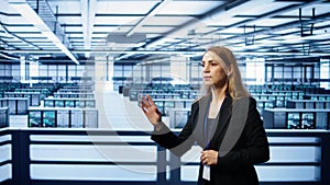 Software developer looking at holograms in data center, monitoring infrastructure