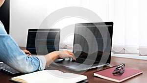 Software developer or programmer working data debugging improvement binary algorithm on desktop pc in a software develop company