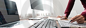 Software developer or programmer working data debugging improvement binary algorithm on desktop pc in a software develop company