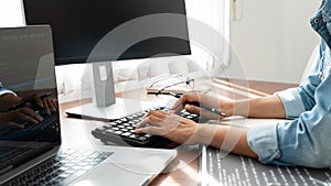 Software developer or programmer working data debugging improvement binary algorithm on desktop pc in a software develop company