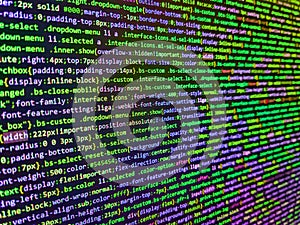 Software developer programming code on computer. Laptop screen show abstract computer programming code script. Abstract program