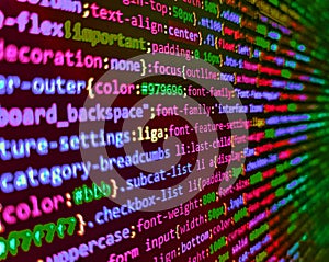 Software developer programming code on computer monitor. Computer script coding source code on desktop monitor. Future technology