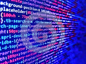 Software developer programming code. Data encryption security code on a computer display. Real Html code developing screen.