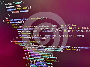 Software developer programming code. Mobile app building. Blurred screen with selective focus. Script on computer with source code