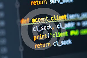 Software developer programming code on the screen of computer display. Program development